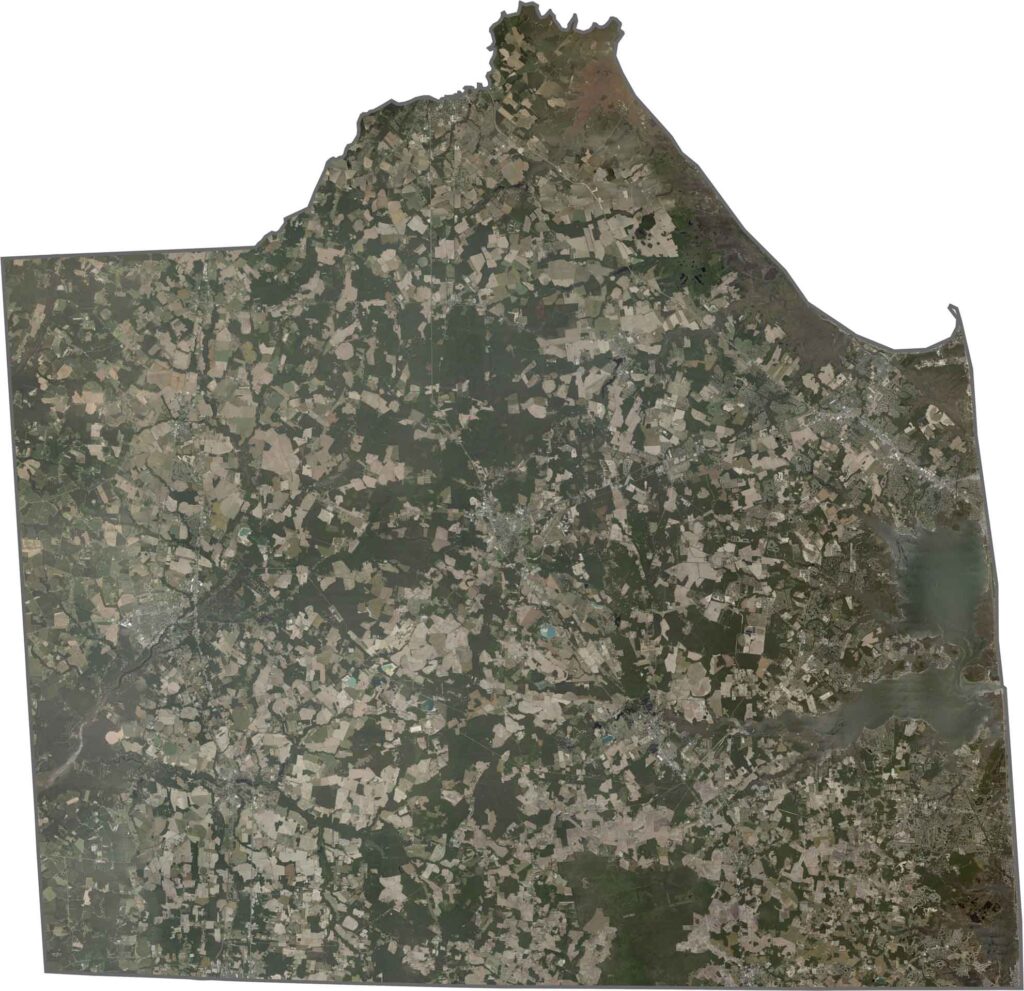 Satellite map of Sussex County, Delaware showing land use, roads, waterways, forests, and urban areas.